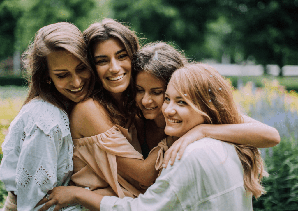 Women hugging and smiling